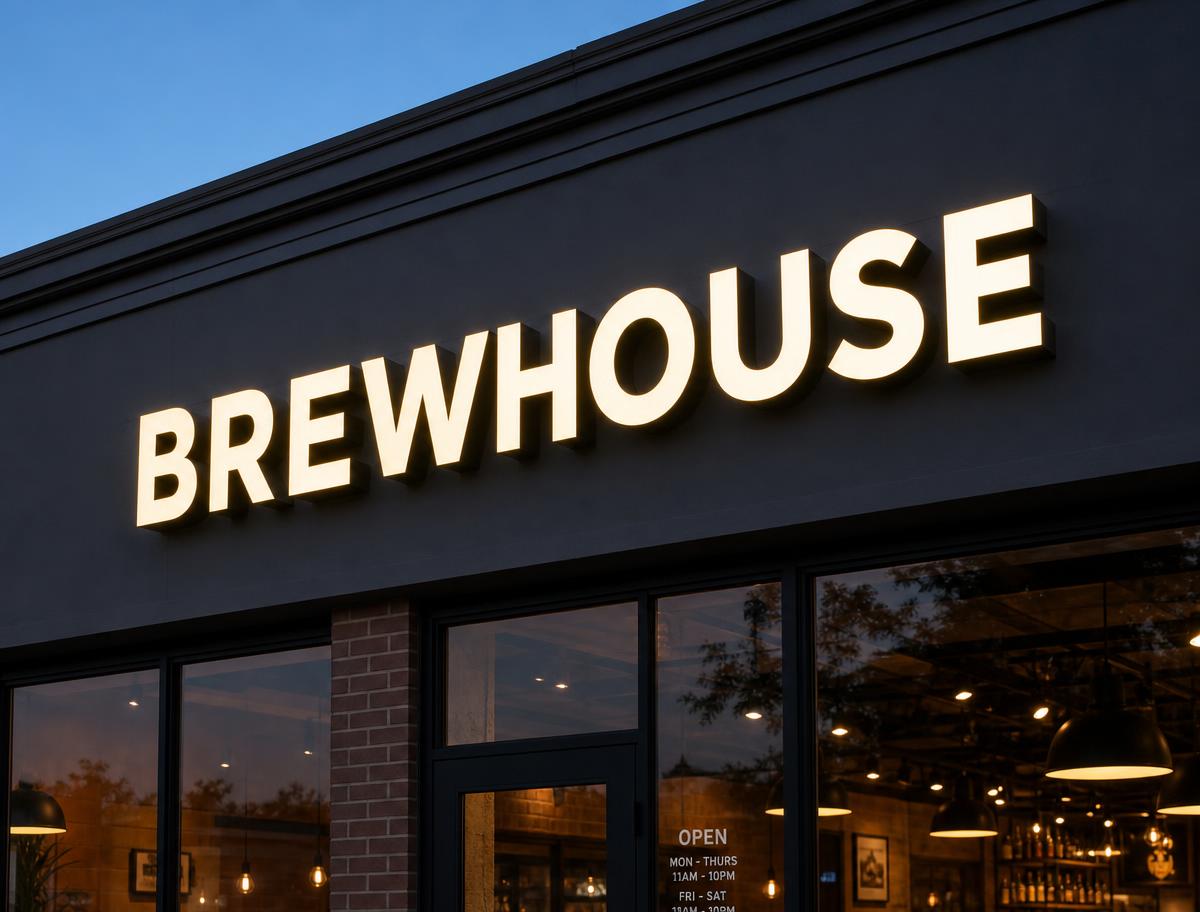 Warm white front-lit channel letters reading BREWHOUSE on a storefront fascia